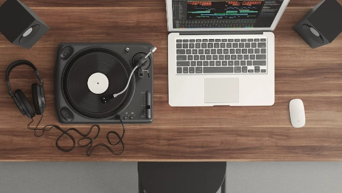 vinyl disc player and a laptop