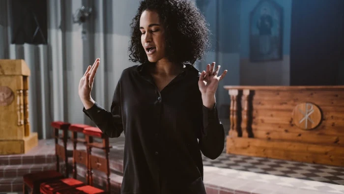 woman singing at church