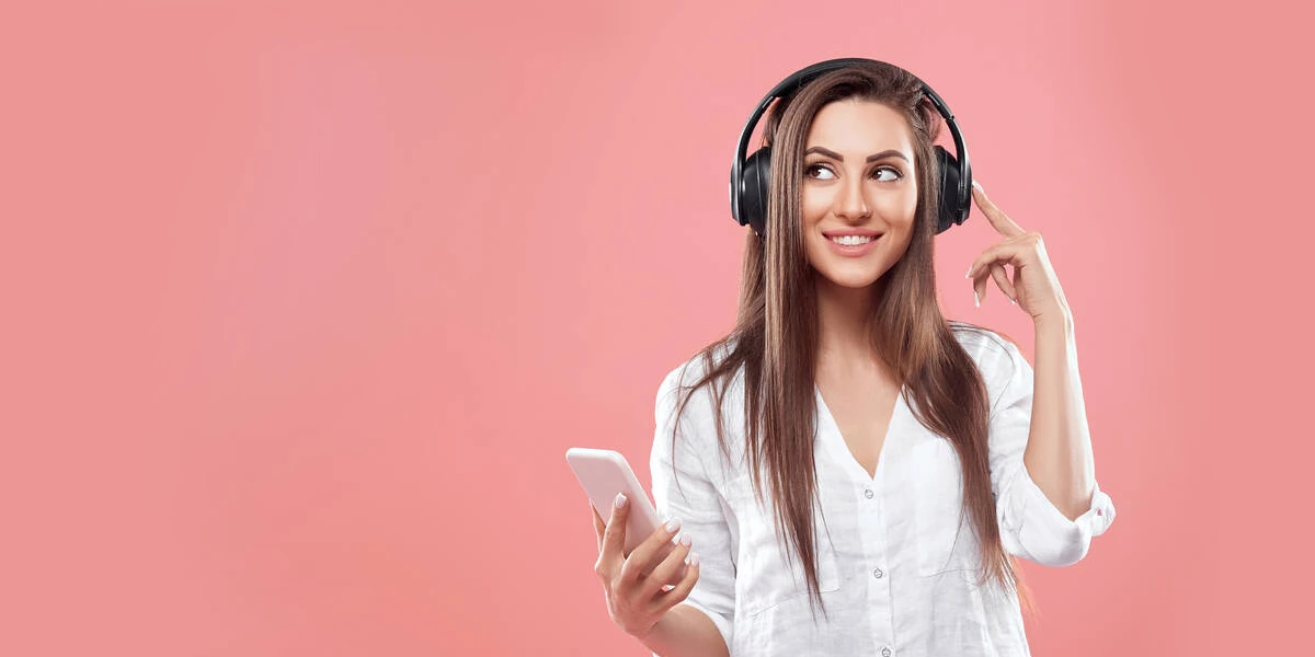 woman listen to music with a smartphone and a headphone