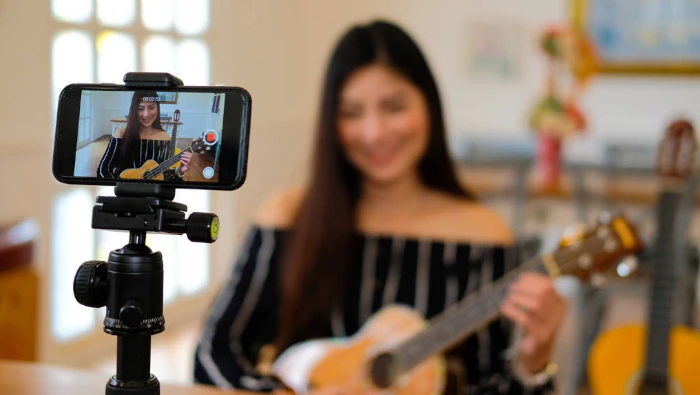 woman playing acoustic guitar