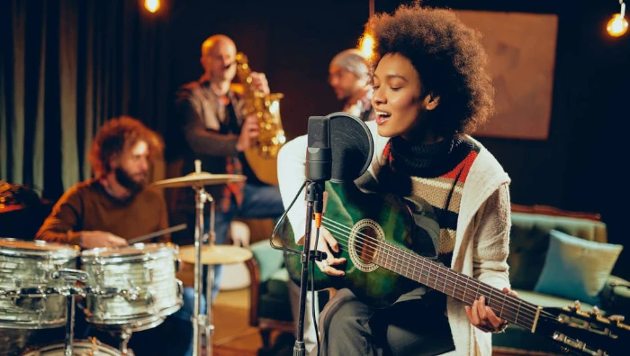 musicians playing many musical instruments in a recording studio