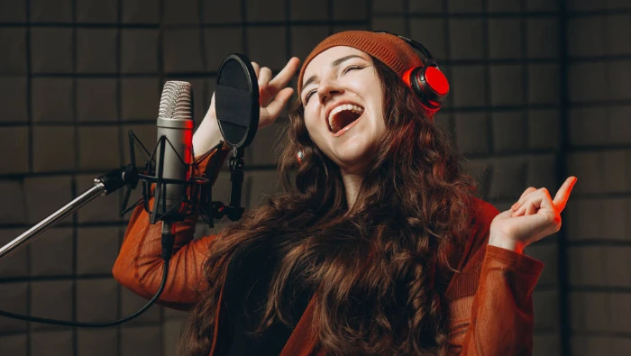 woman singing at studio