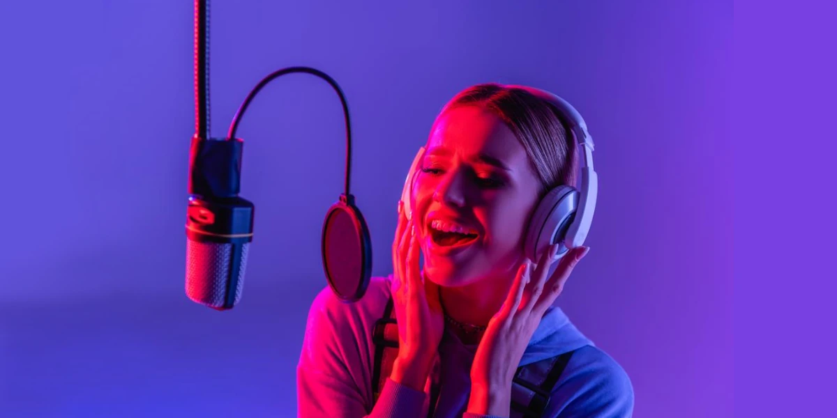 woman singing in front of microphone