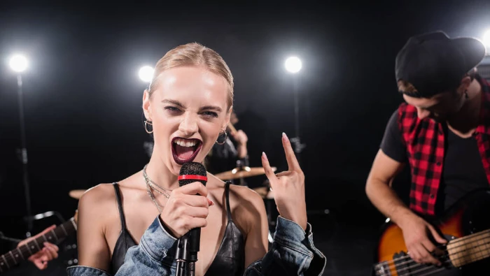 woman singing live with SM58 microphone